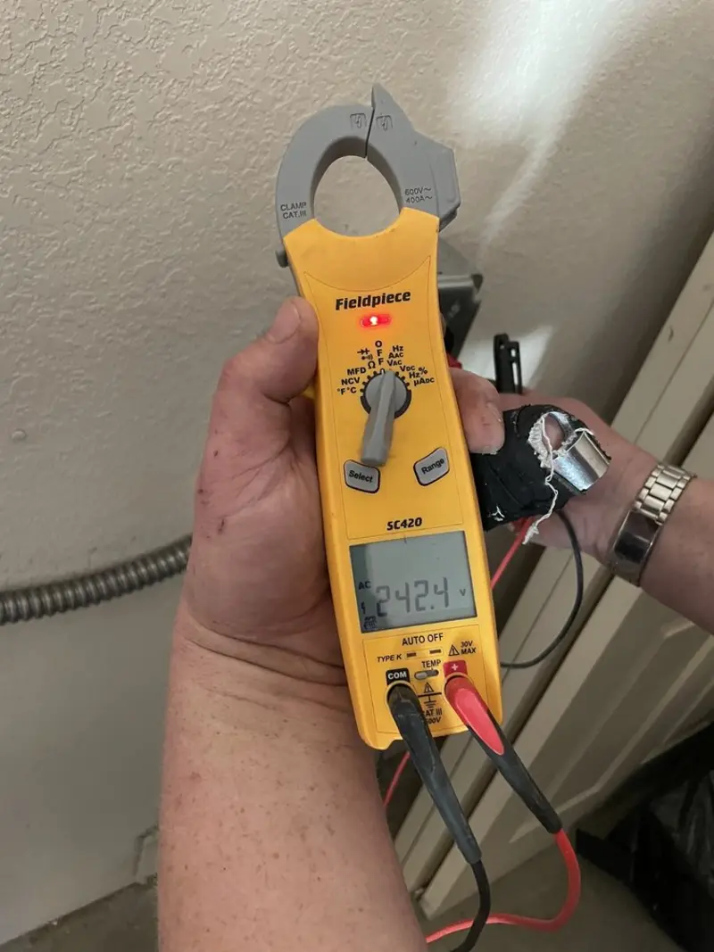Voltage testing with clamp meter during Outlet Installation in Riverton